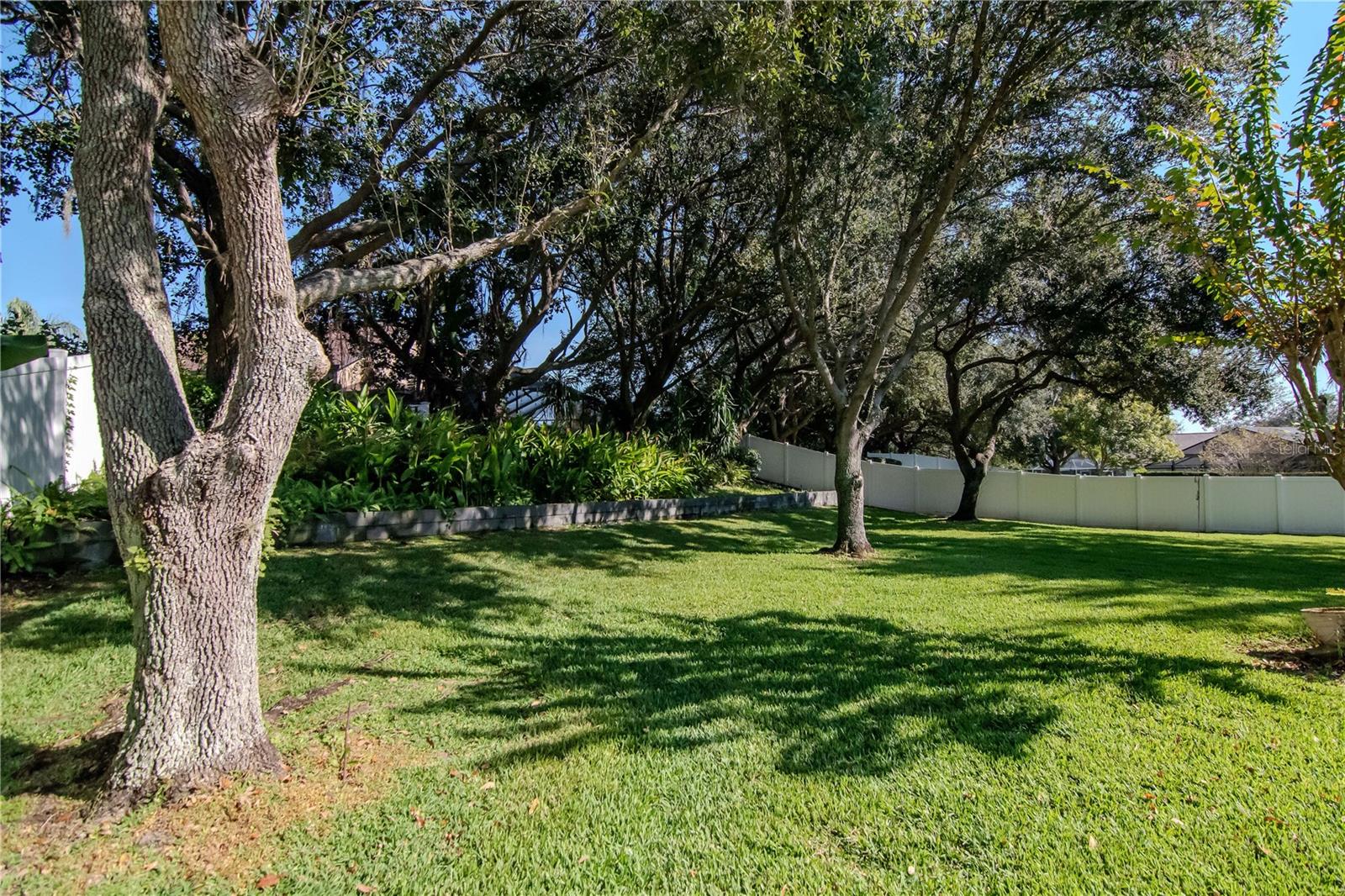 A true backyard oasis! 0.40 acres with lush landscaping and privacy