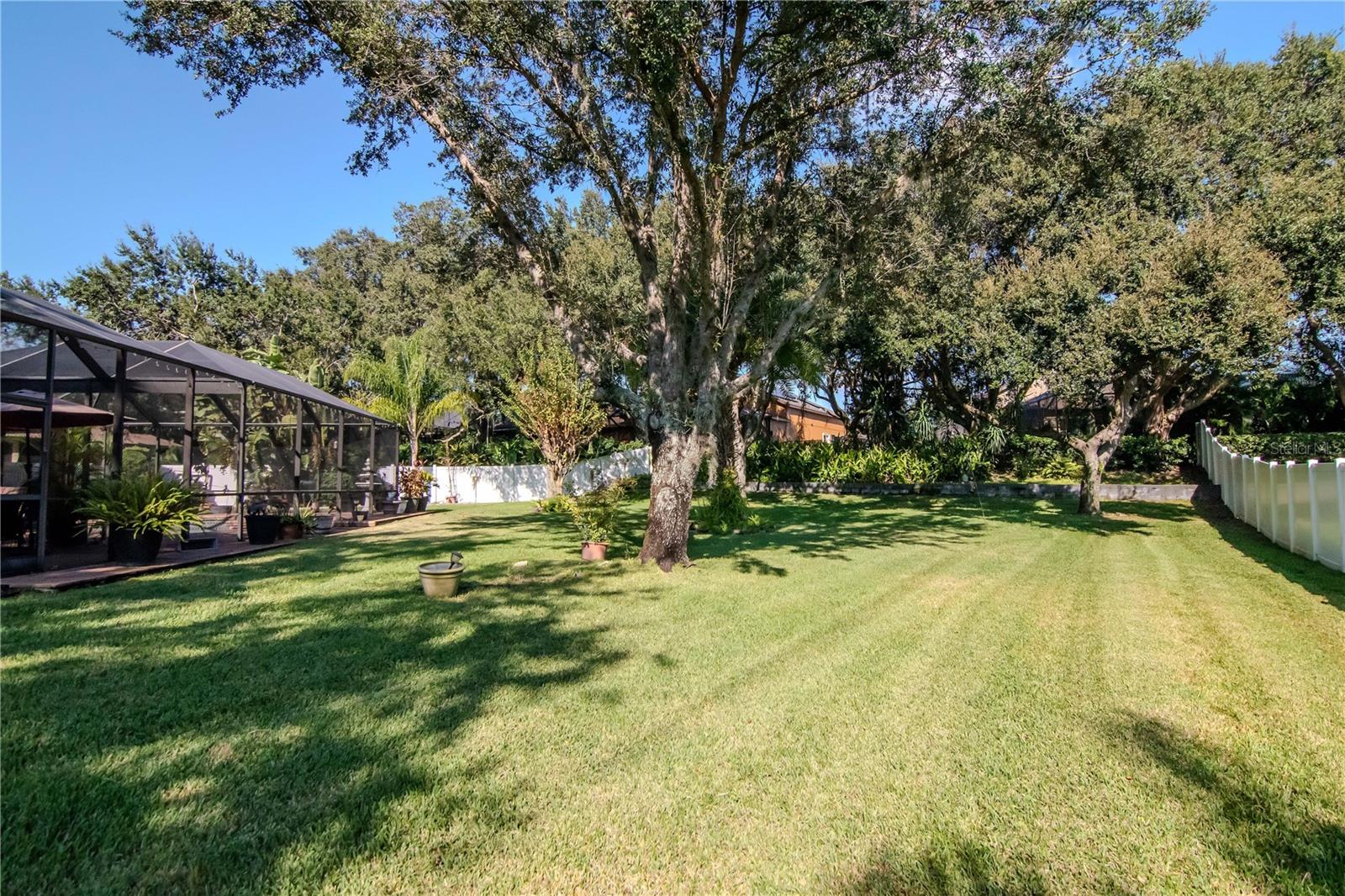A true backyard oasis! 0.40 acres with lush landscaping and privacy