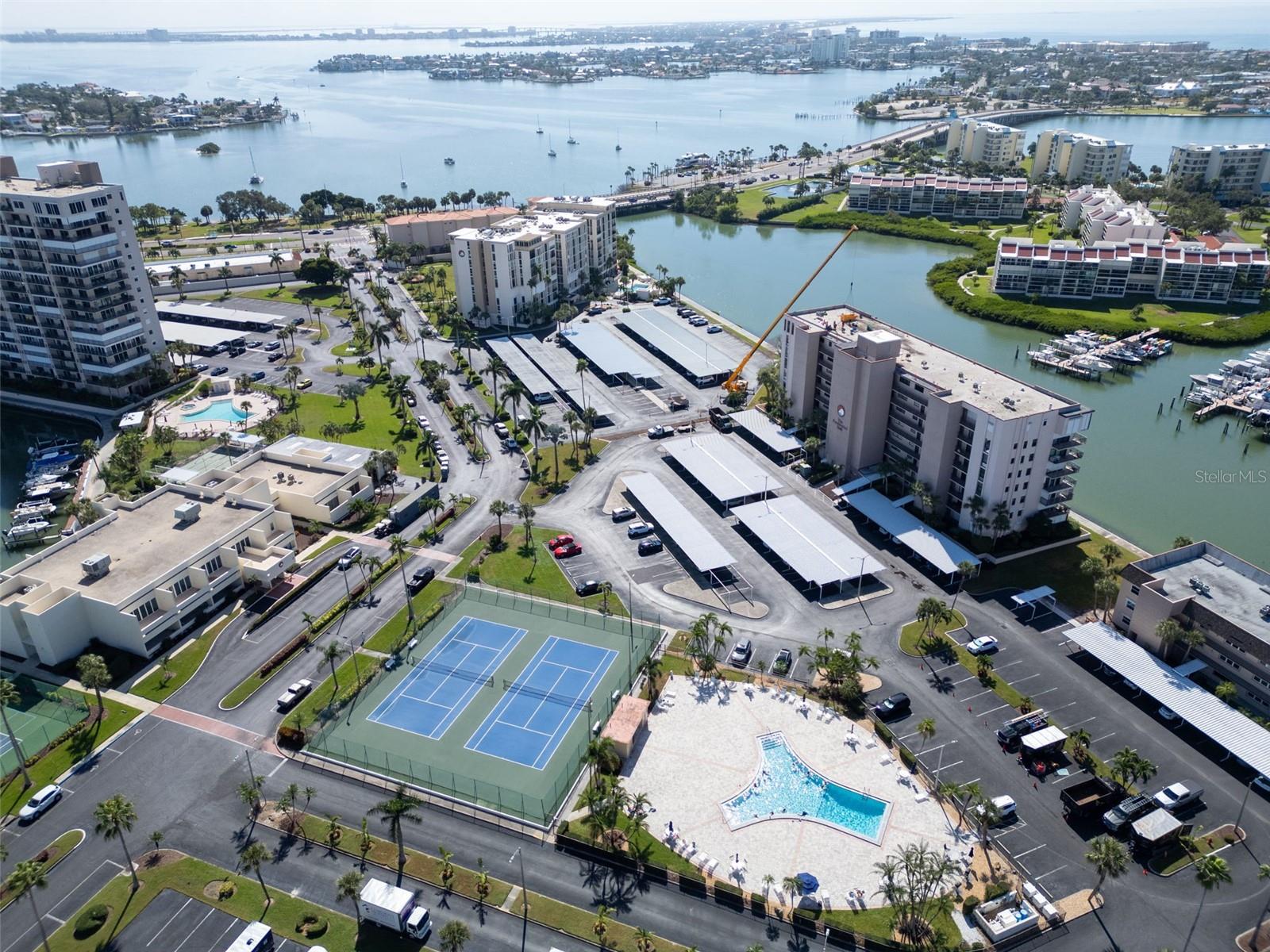 Tiki Hut grilling areas, a 1.5-mile waterfront walkway, and access to a private marina