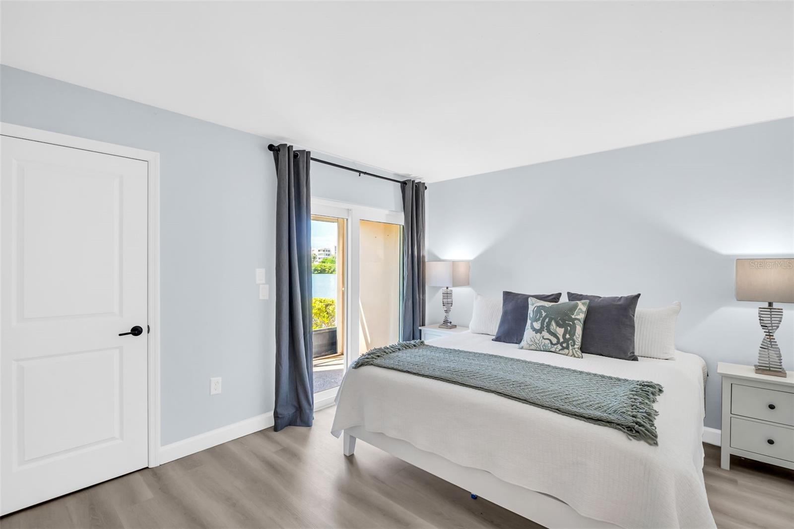 Primary bedroom fits a king sized bed.