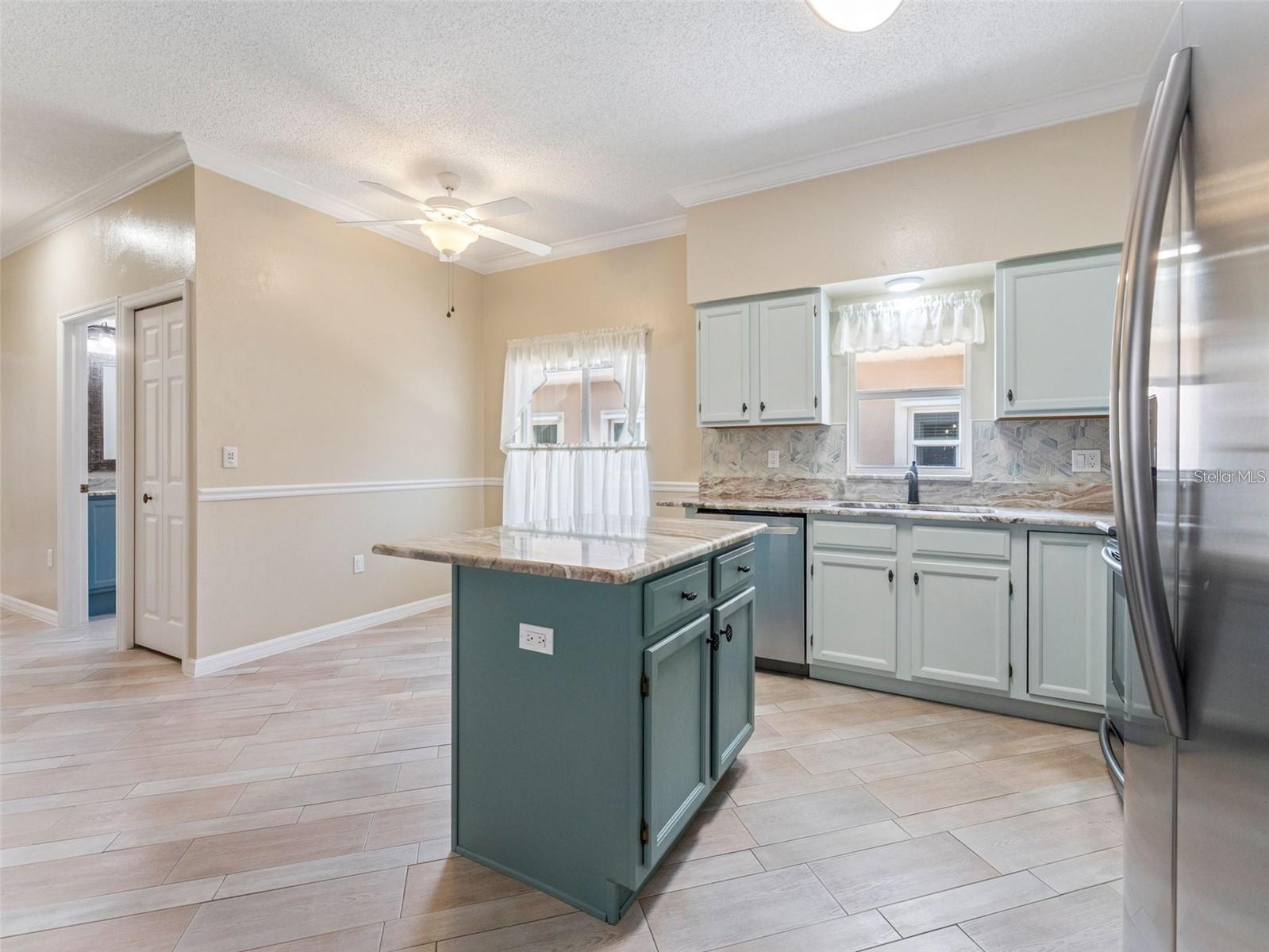 Updated cabinets and fantasy brown granite countertops