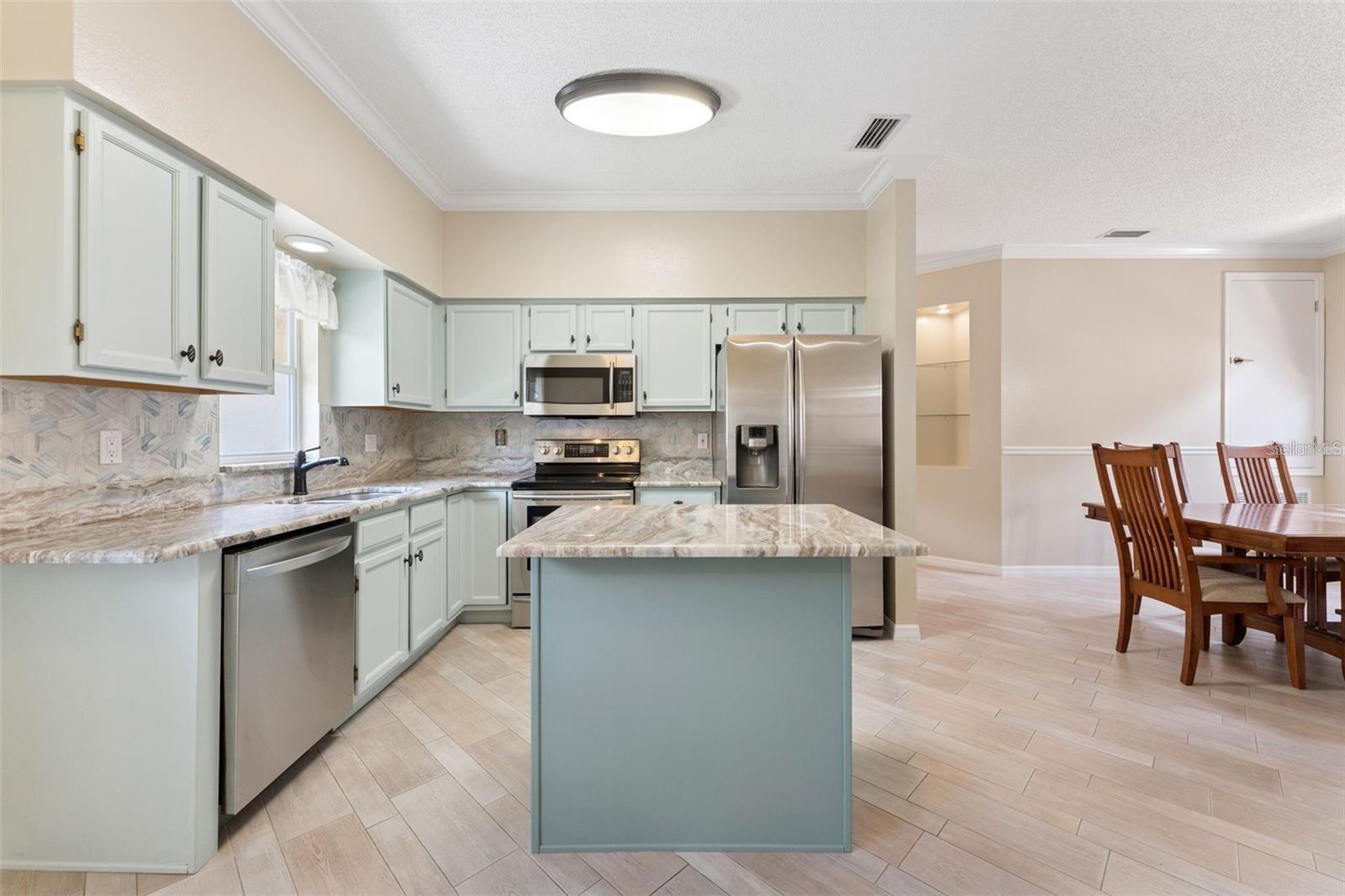 Beautiful tile floors, updated appliances & fixtures