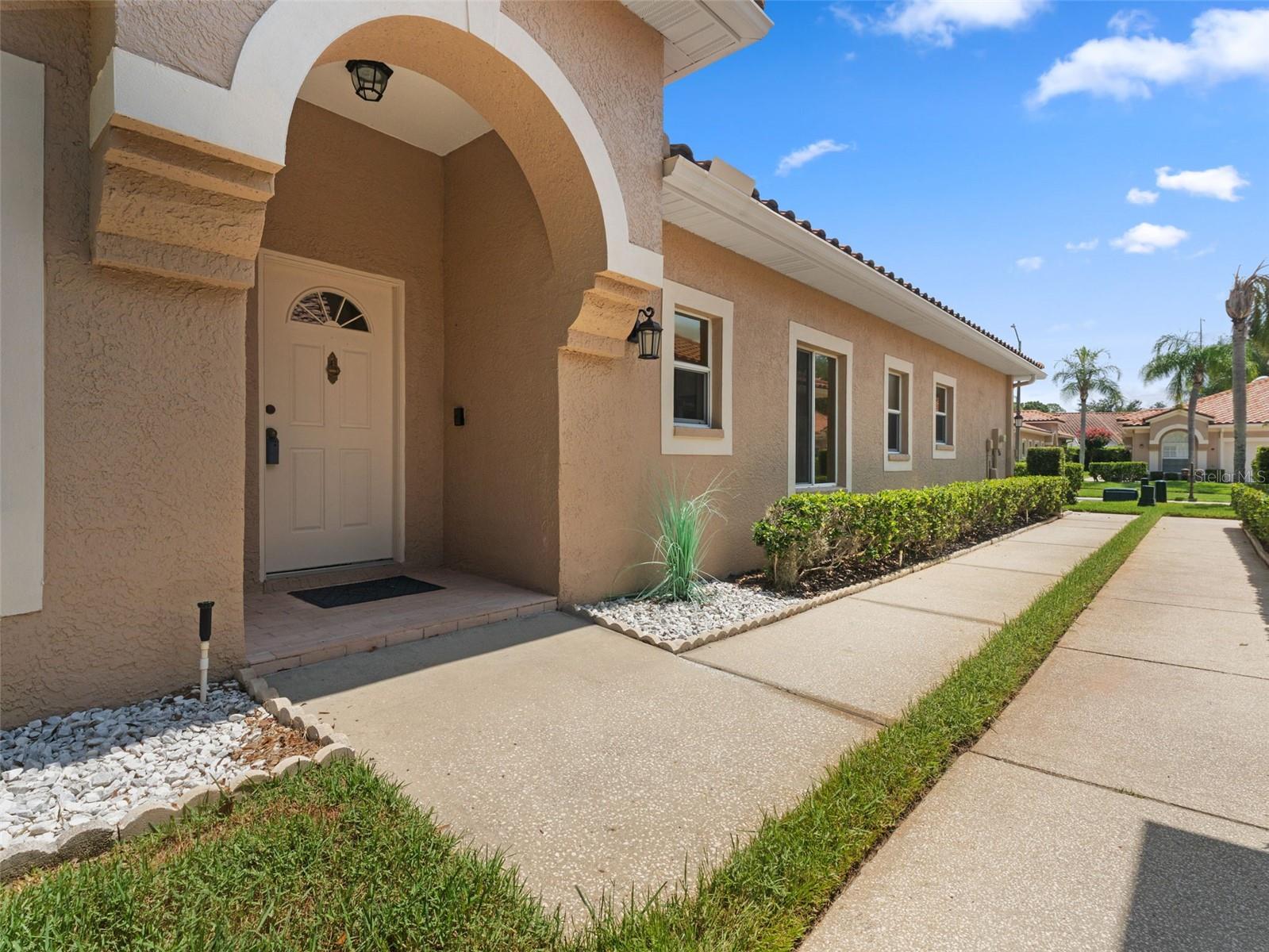 Main entry door located on side of house