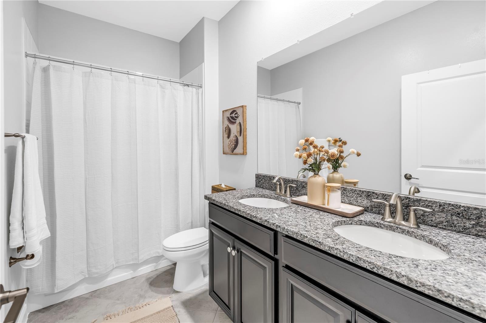 Bathroom 2: Granite Countertops and Dual Vanities at the Front of the House