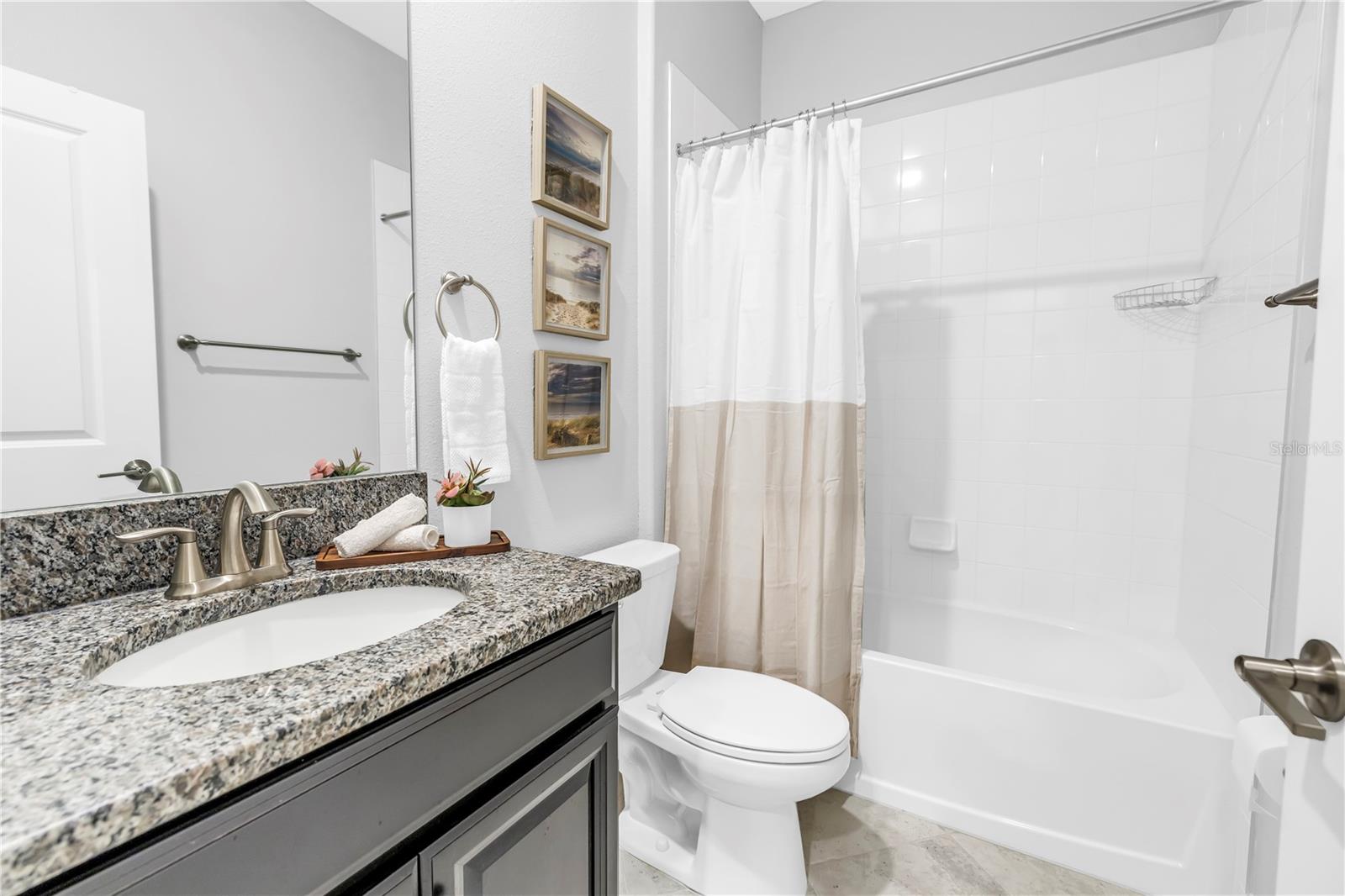 Bathroom 3: Shower/Tub Combination with Granite Countertops