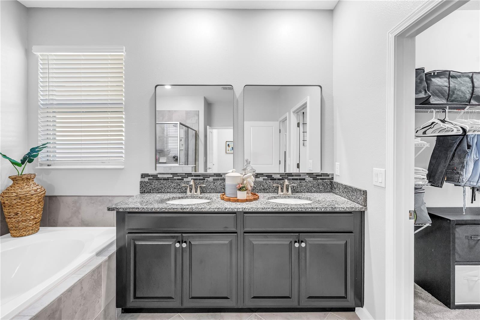 Natural Light floods the space with custom his and hers mirrors