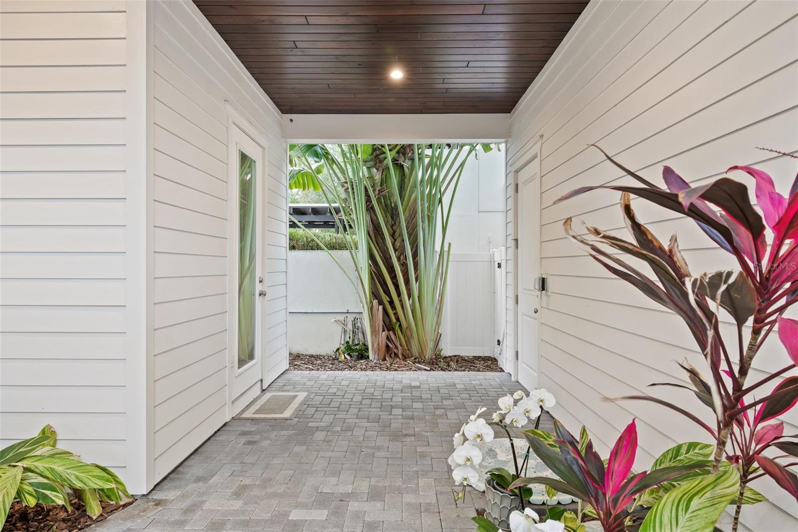 COVERED WALKWAY BETWEEN HOUSE AND GARAGE