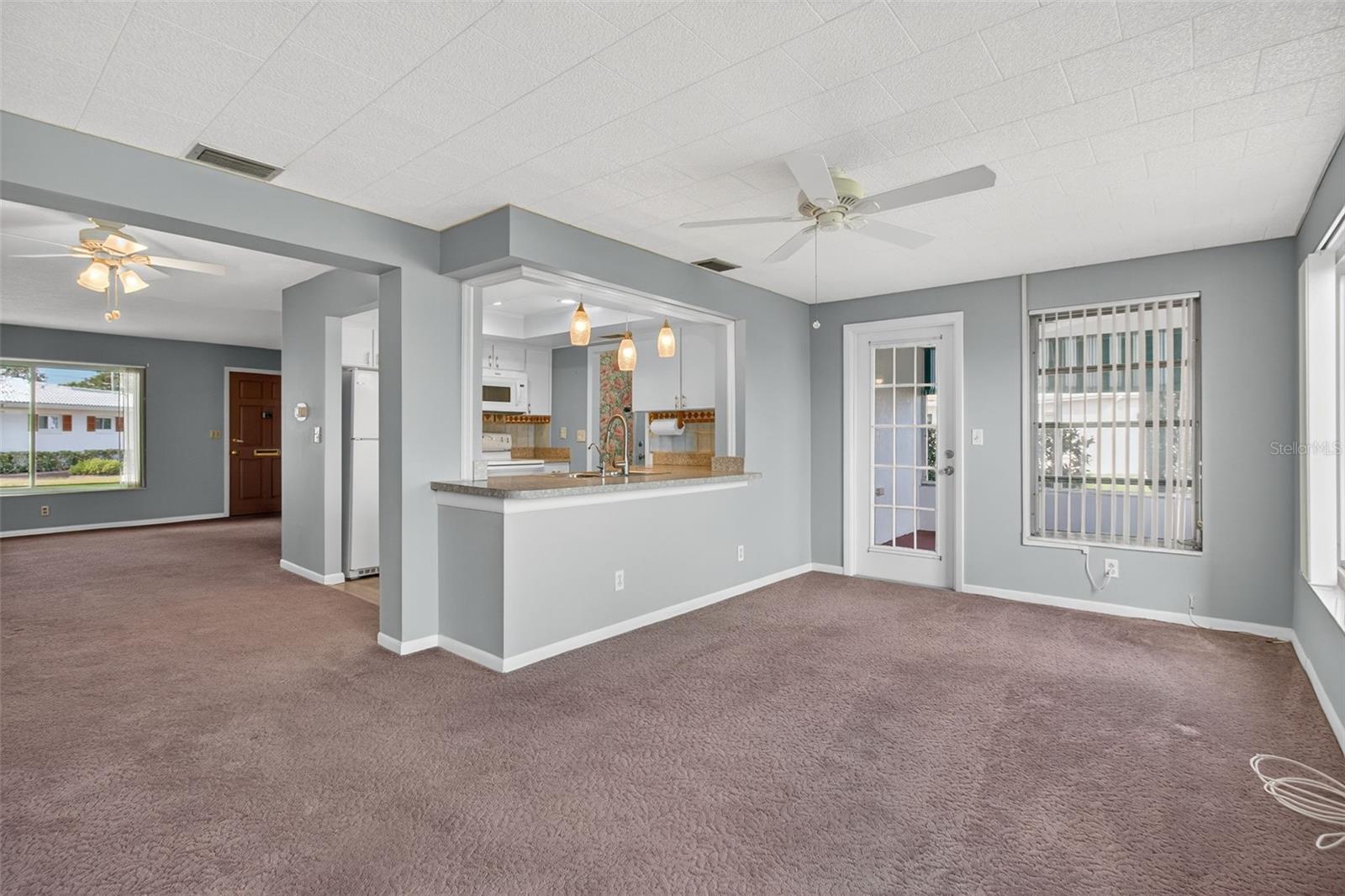 Open floorplan - view from Family Room looking back at Kitchen, Dining Room and Living Room