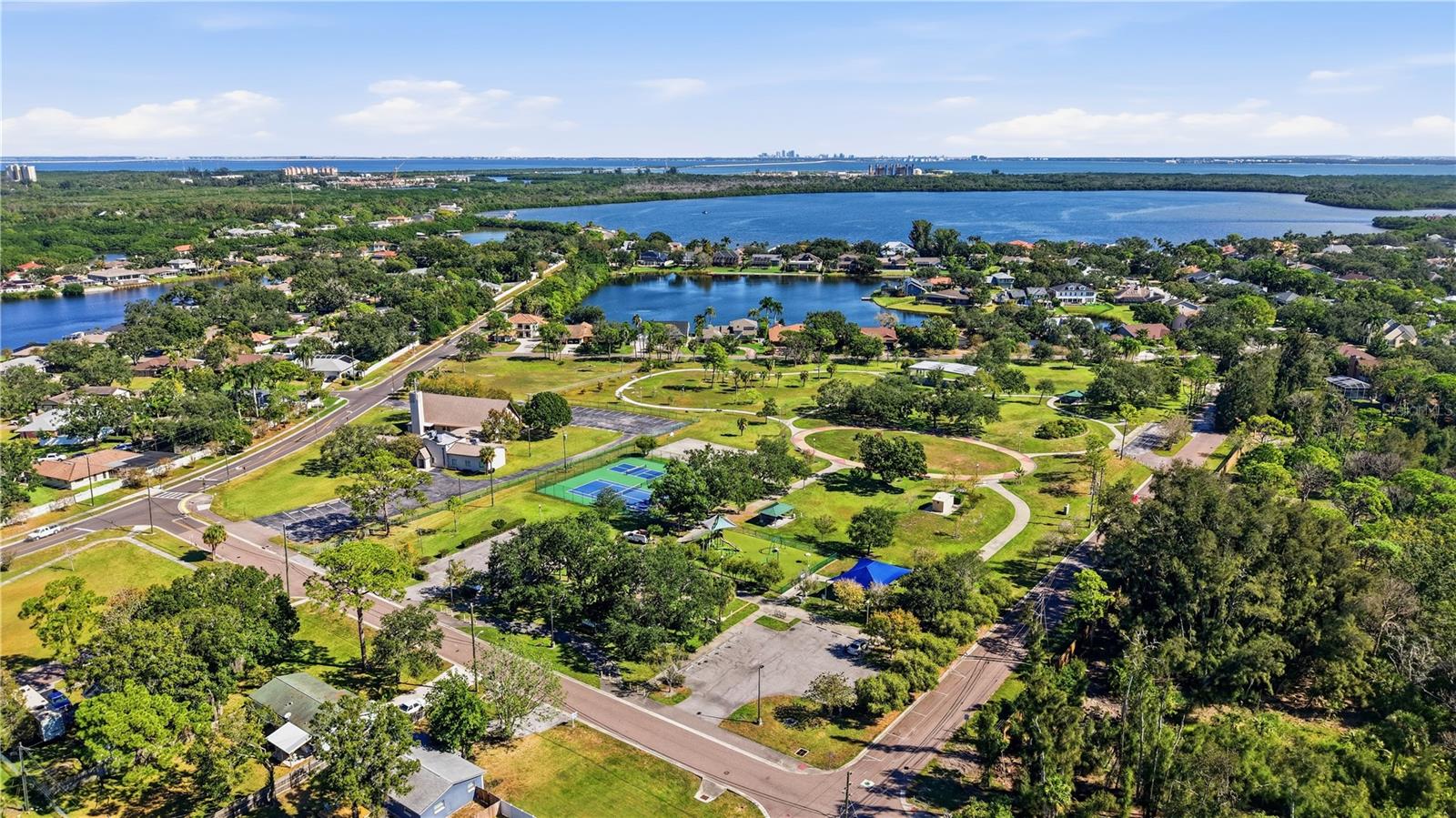 RIVIERA BAY PARK- Offering Pickle ball, tennis, basketball, walking trails, BBA and picnic areas, workout stations