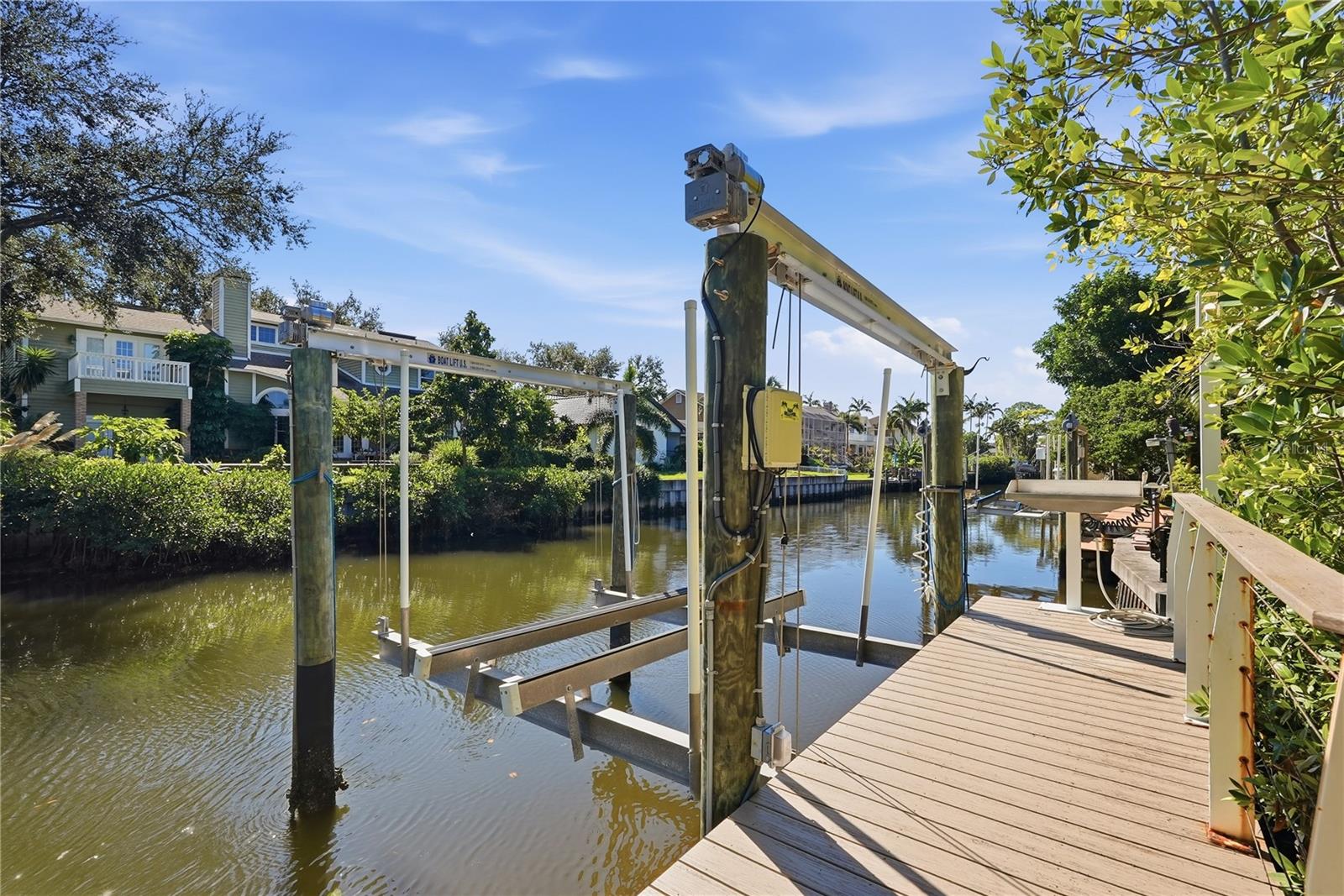 Newer Boat Dock and 13,000LB boat lift  ( Replaced in 2021) New synthetic wood dock