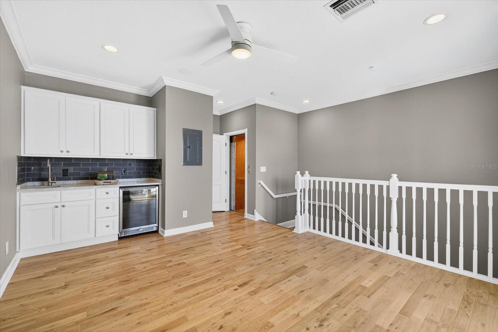 wet bar and beverage cooler in 4th bedroom