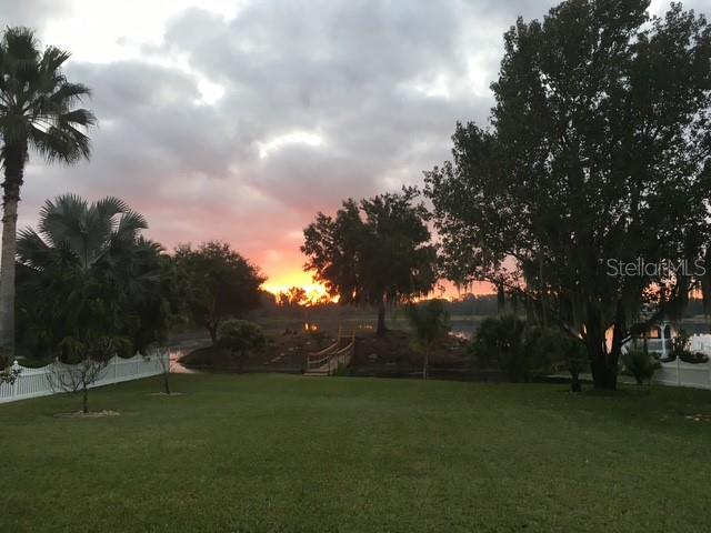 A backyard that flows into the sparkling lake.