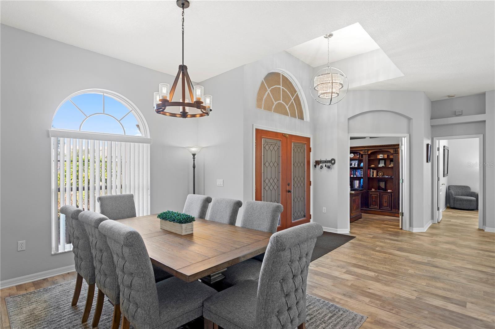 Open-concept layout with soaring ceilings.