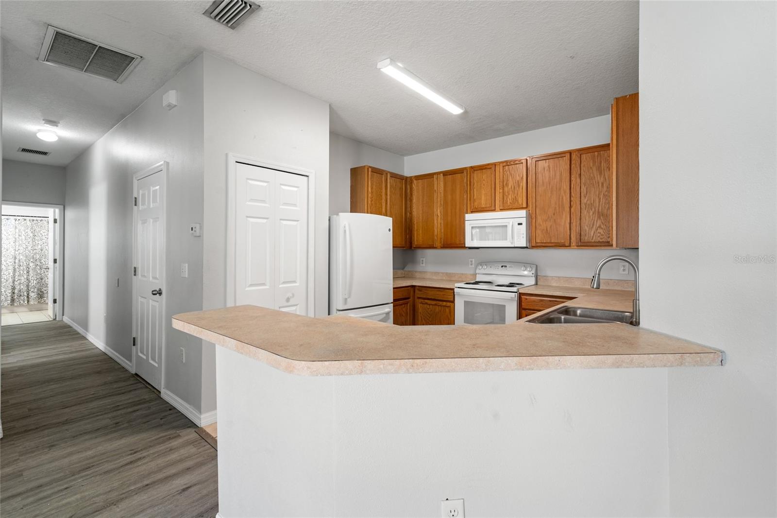 Kitchen and hallway view.