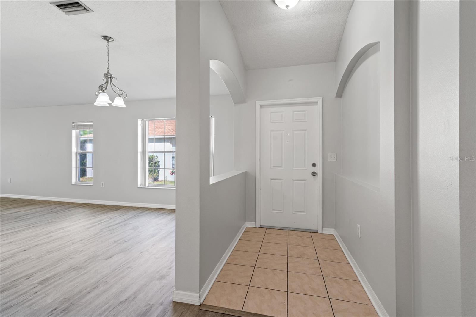 Foyer and dining room space.