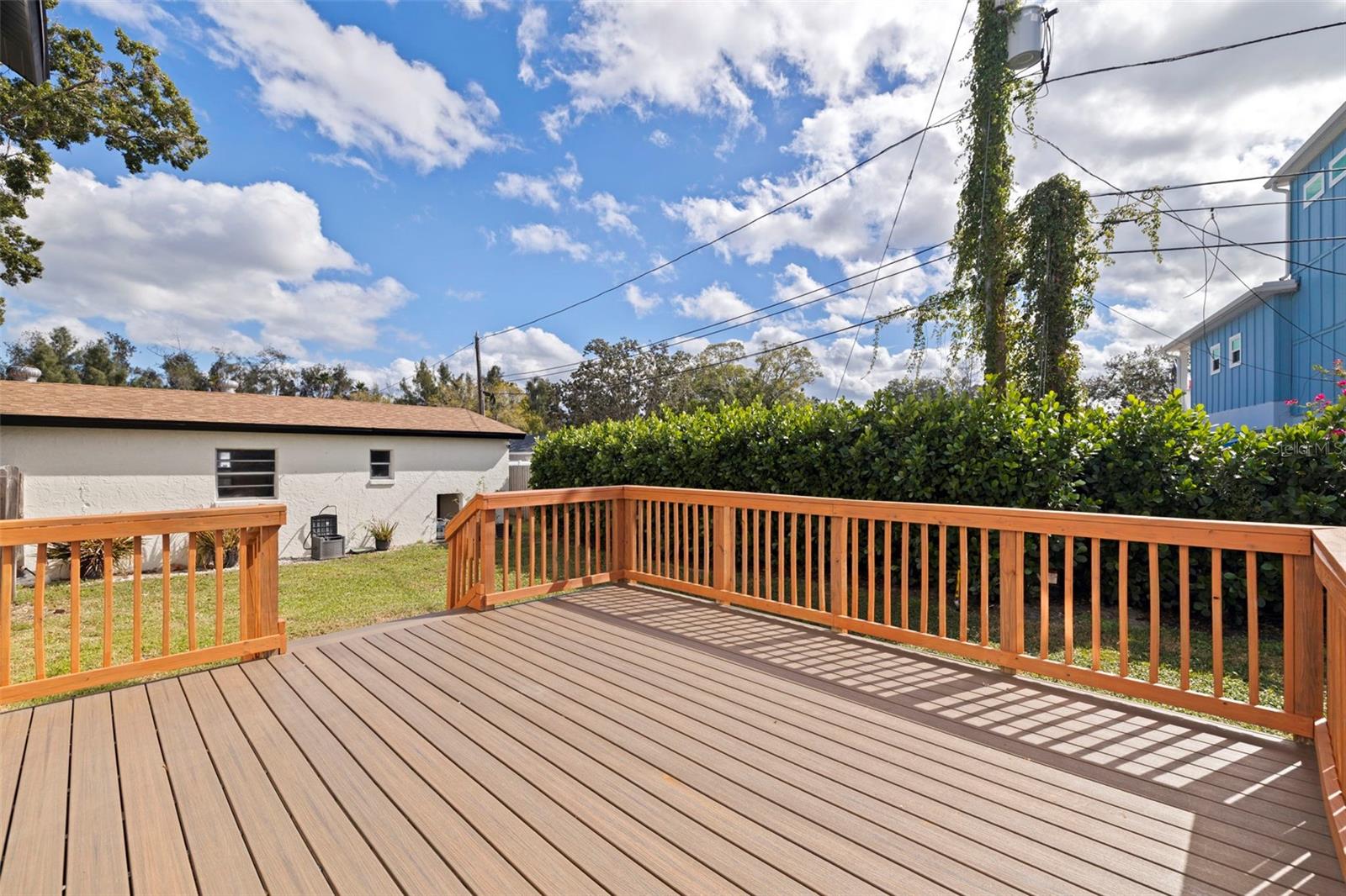 spacious TREX deck overlooking fenced yard