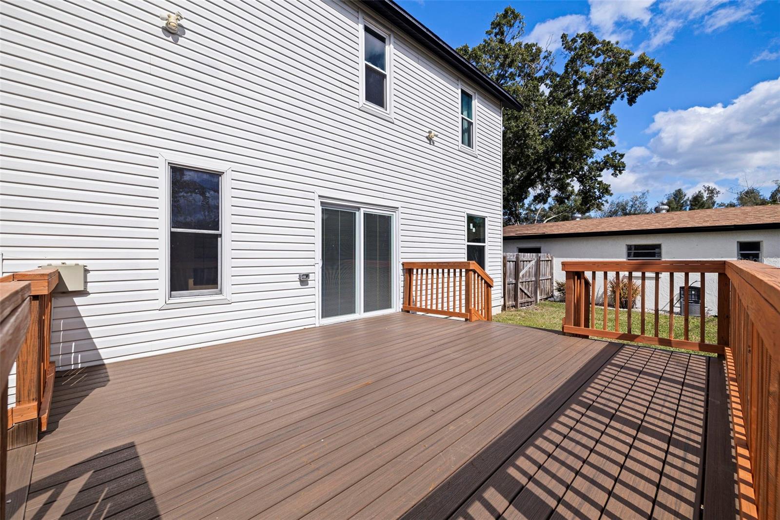 spacious low maintenance deck overlooking fenced yard
