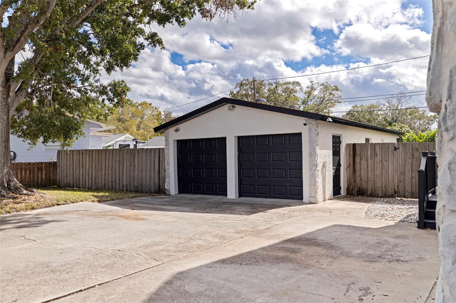 detached 2 car garage and full bath for possible ADU (needs reno)