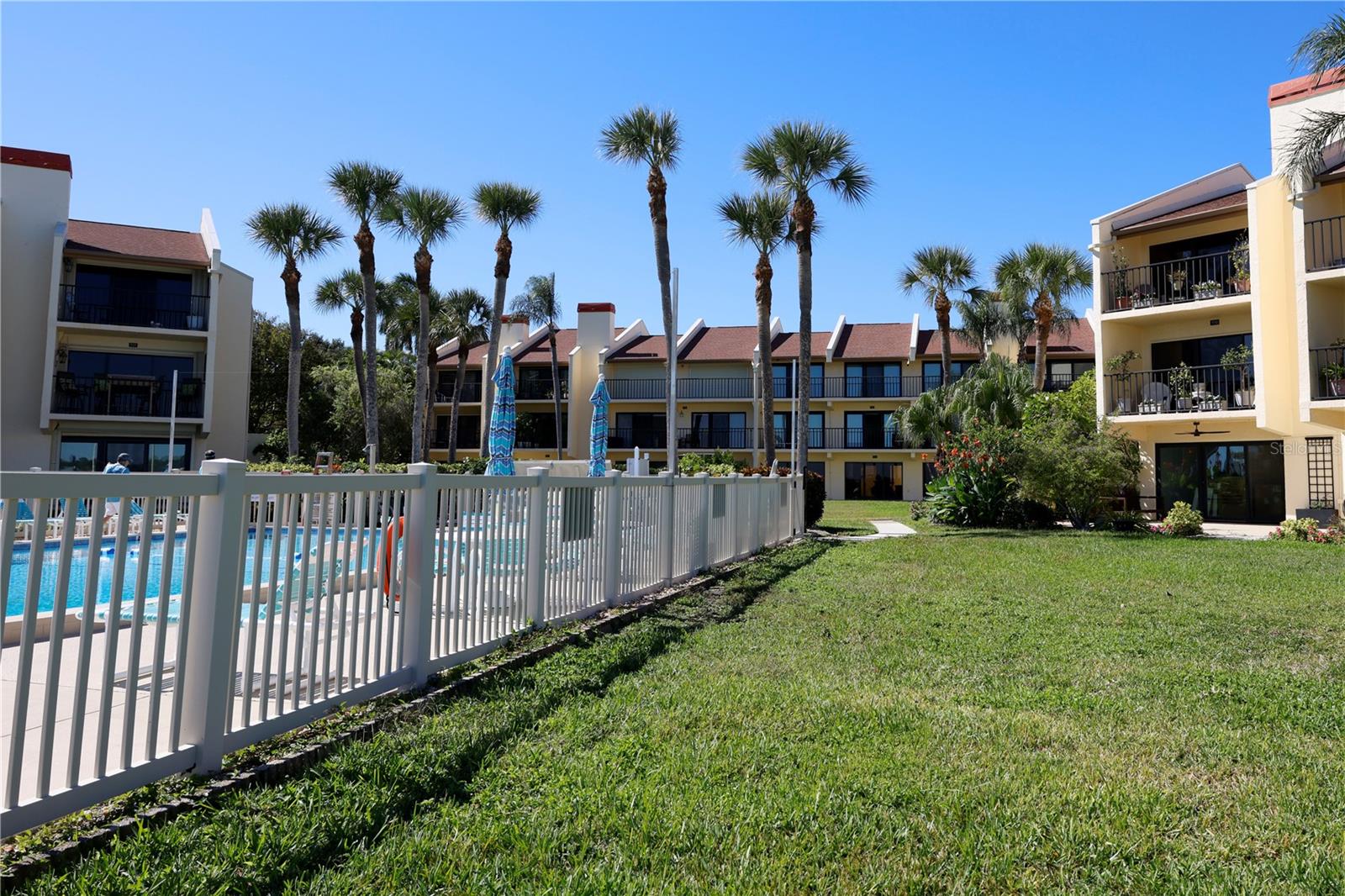 Pool view looking toward condo building.