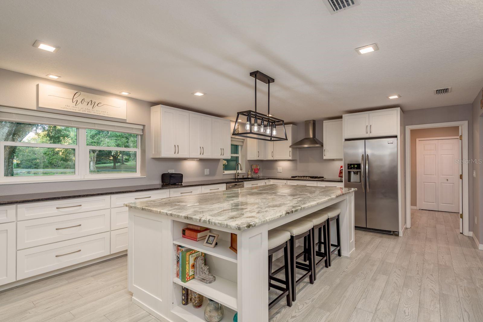 Eat at the island or the table. Don't forget a full dining room table in the dining room.