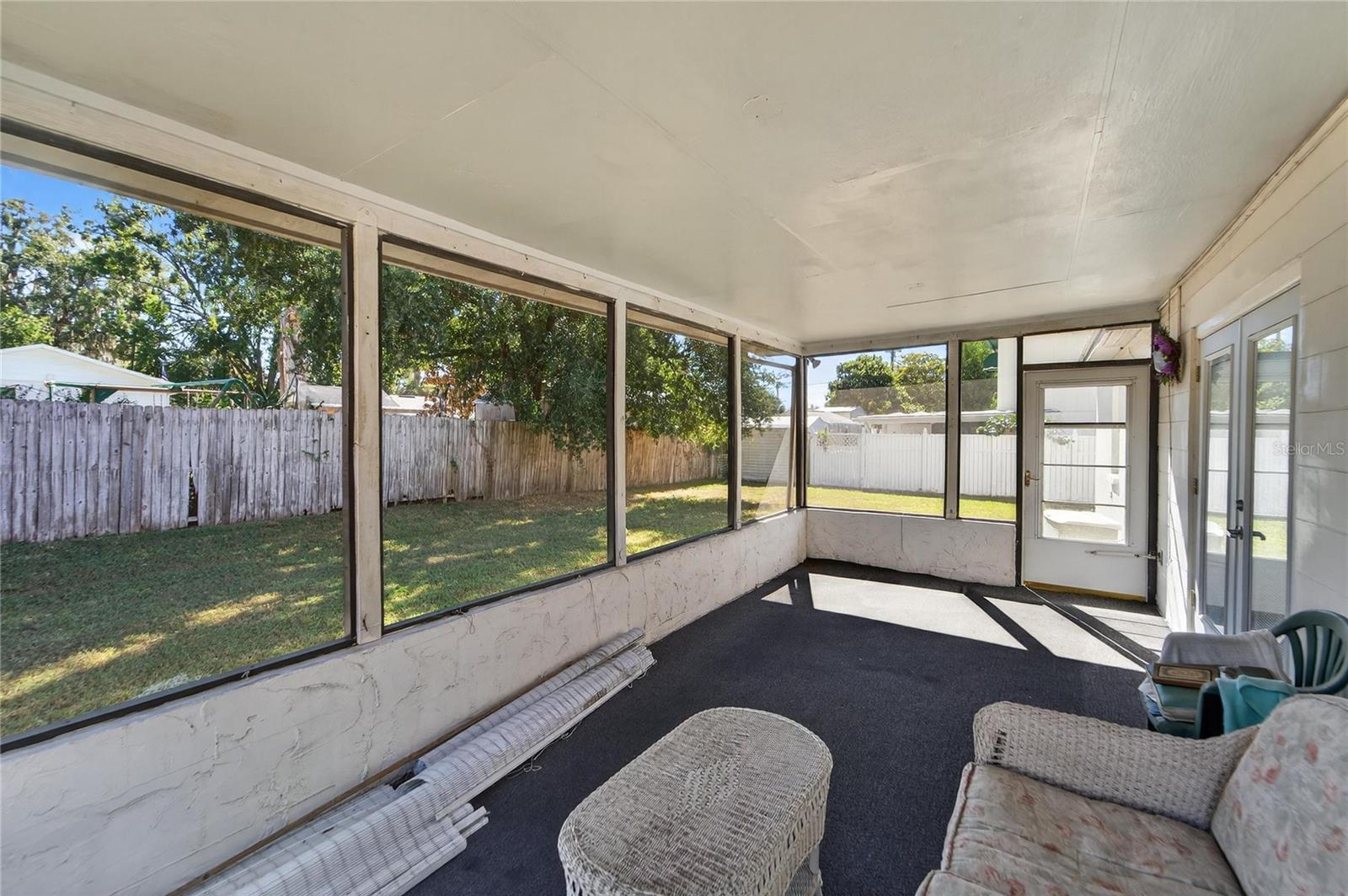Rear screened-in covered porch at 204 Sugar Creek Dr, Plant City