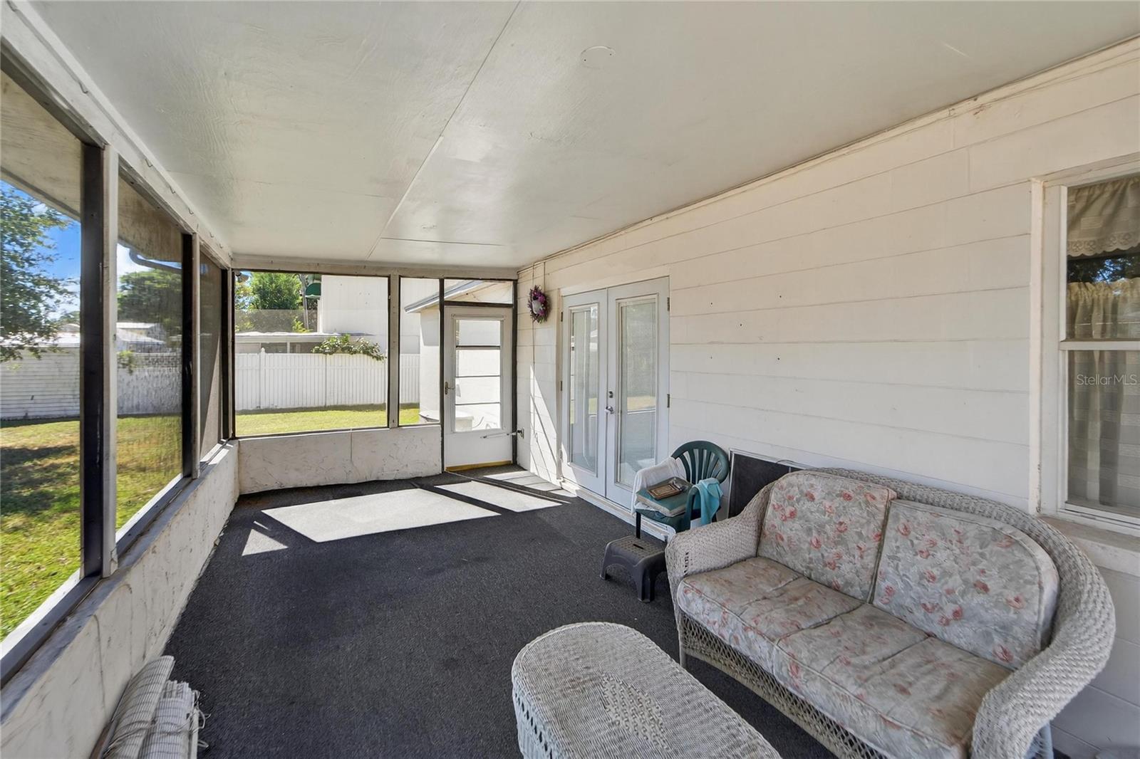 Rear screened-in covered porch at 204 Sugar Creek Dr, Plant City