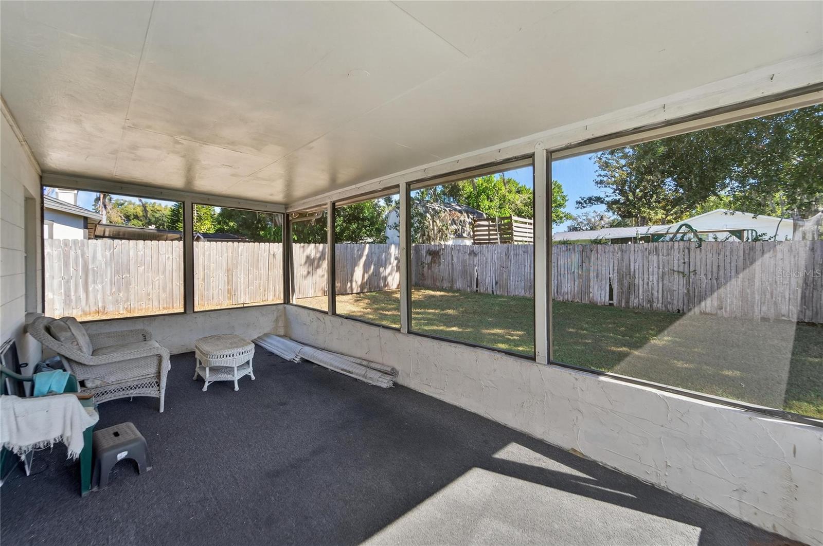 Rear screened-in covered porch at 204 Sugar Creek Dr, Plant City