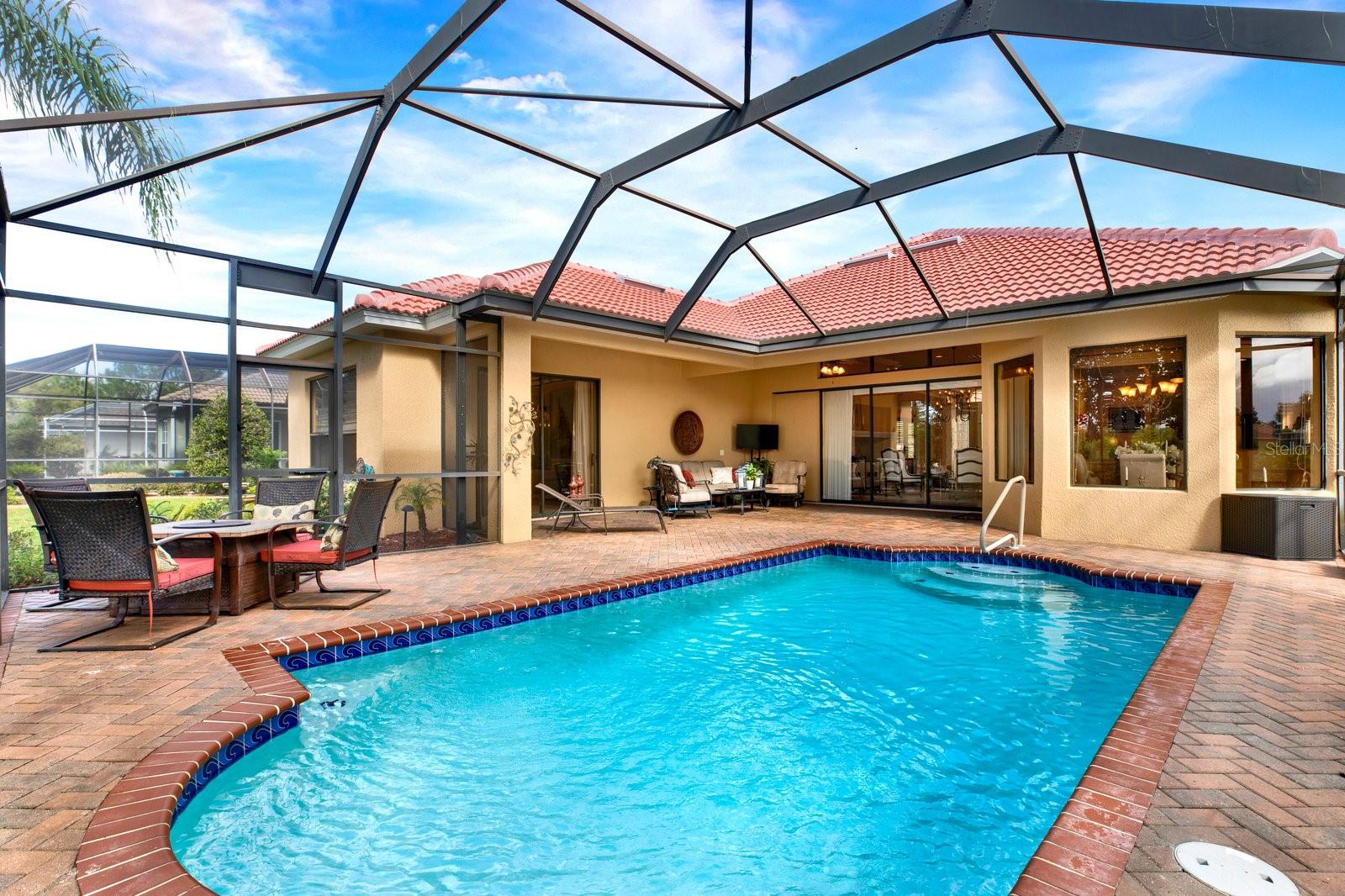 Relax and unwind in this private paradise featuring a sparkling Heated Pool and Impressive Patio area