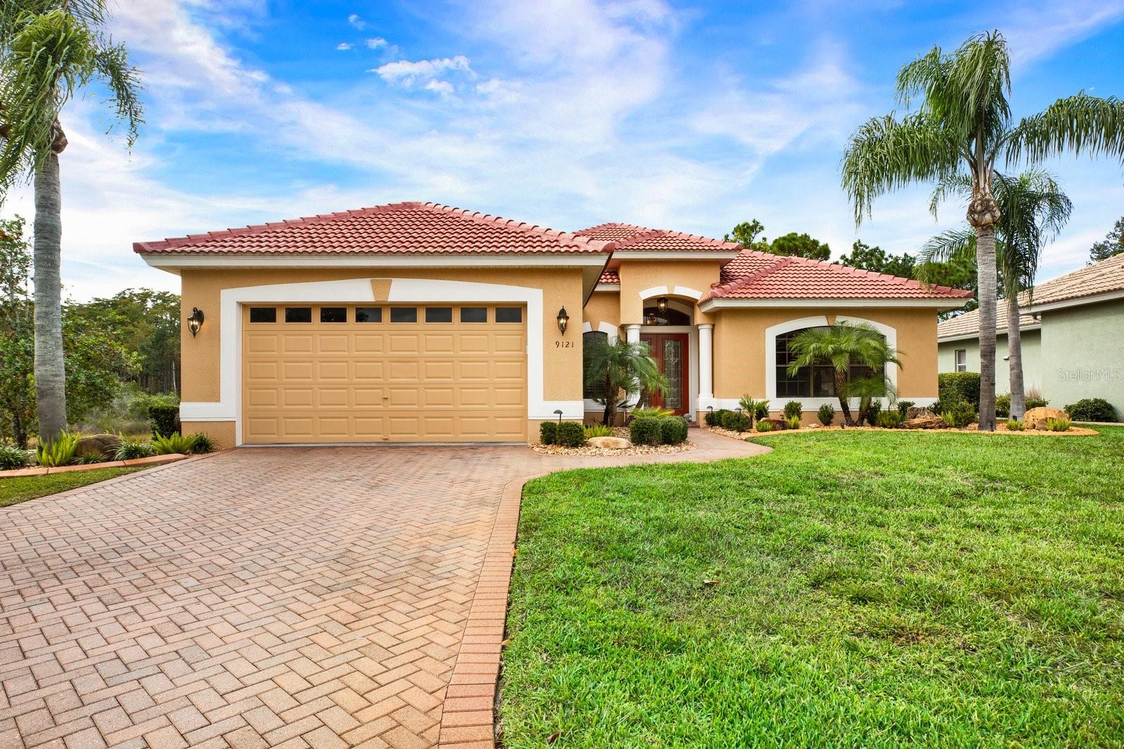 Impressive curb appeal welcomes you to this custom-built home