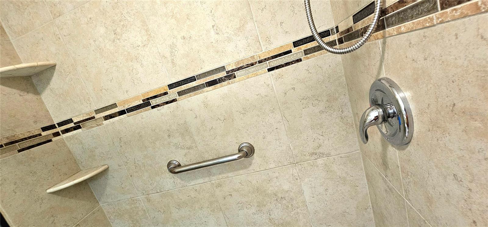 Shelving built into the shower.