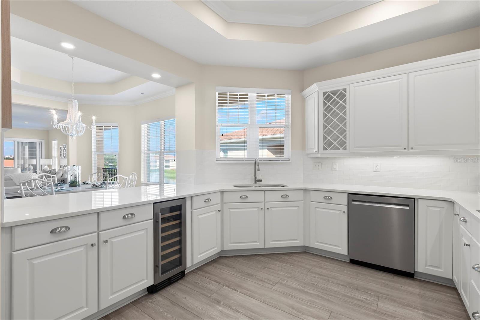 Spectacular bathed-in-light Kitchen, with endless counter space, Kitchen-Aid appliances and ample storage.