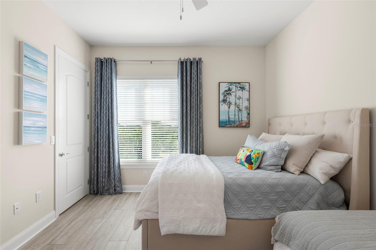 Guest Bedroom 3, with large walk-in closet, blackout window treatments and Jack-n-Jill Bath.