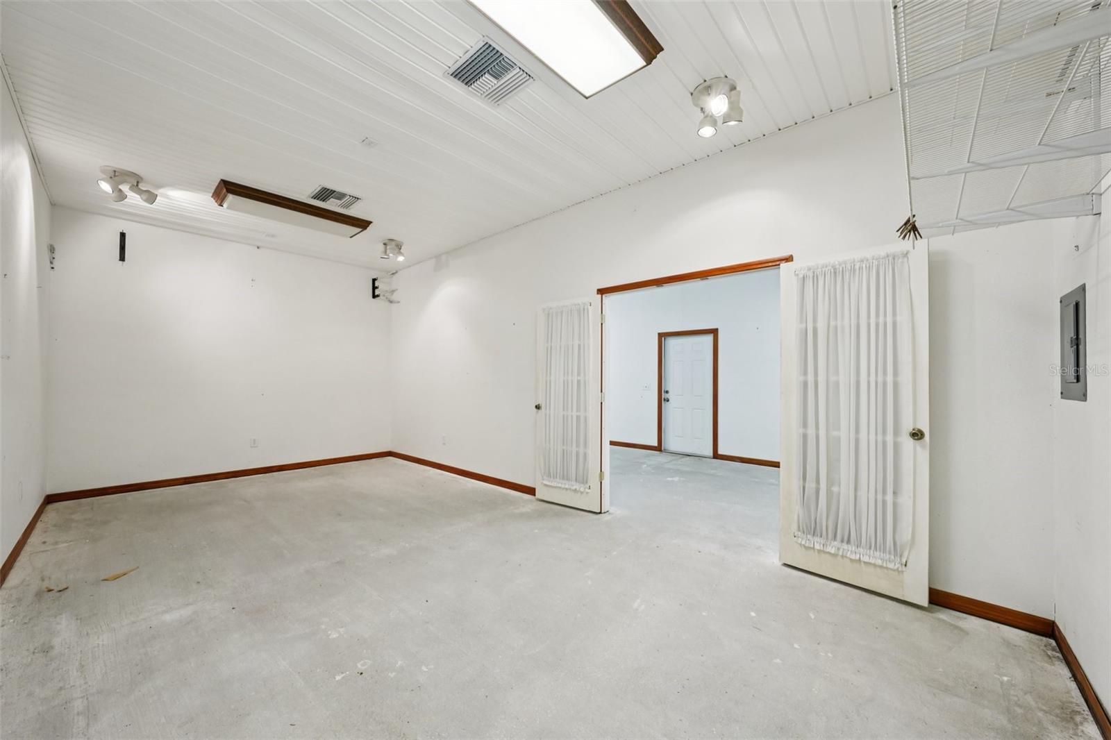 Interior of out-building #1 back room showing front door entrance