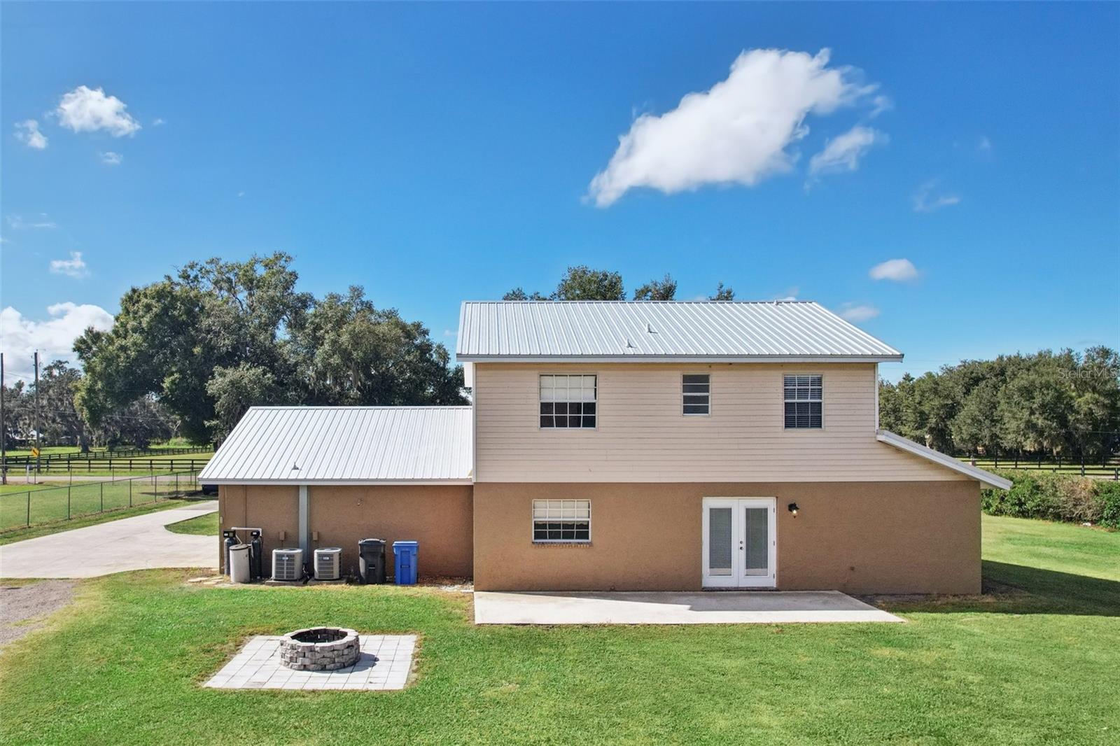 Rear of home with fire-pit