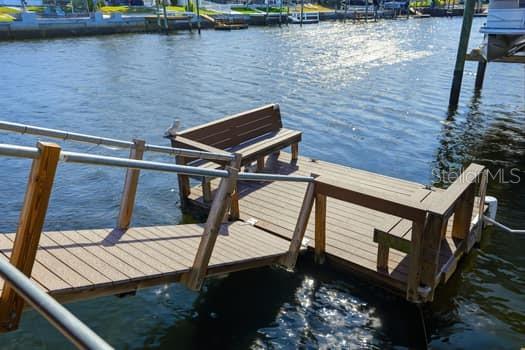 Floating dock with Trex bench seats and a kayak launch