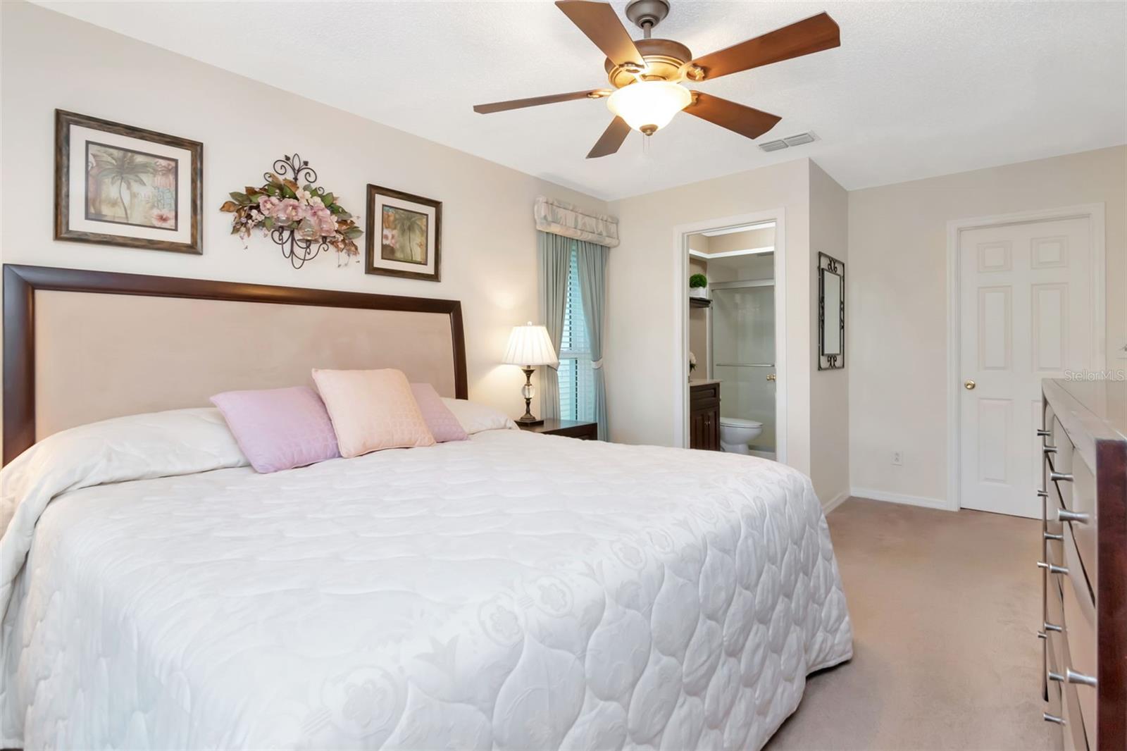 Angle showing walk-in closet door & private bathroom~