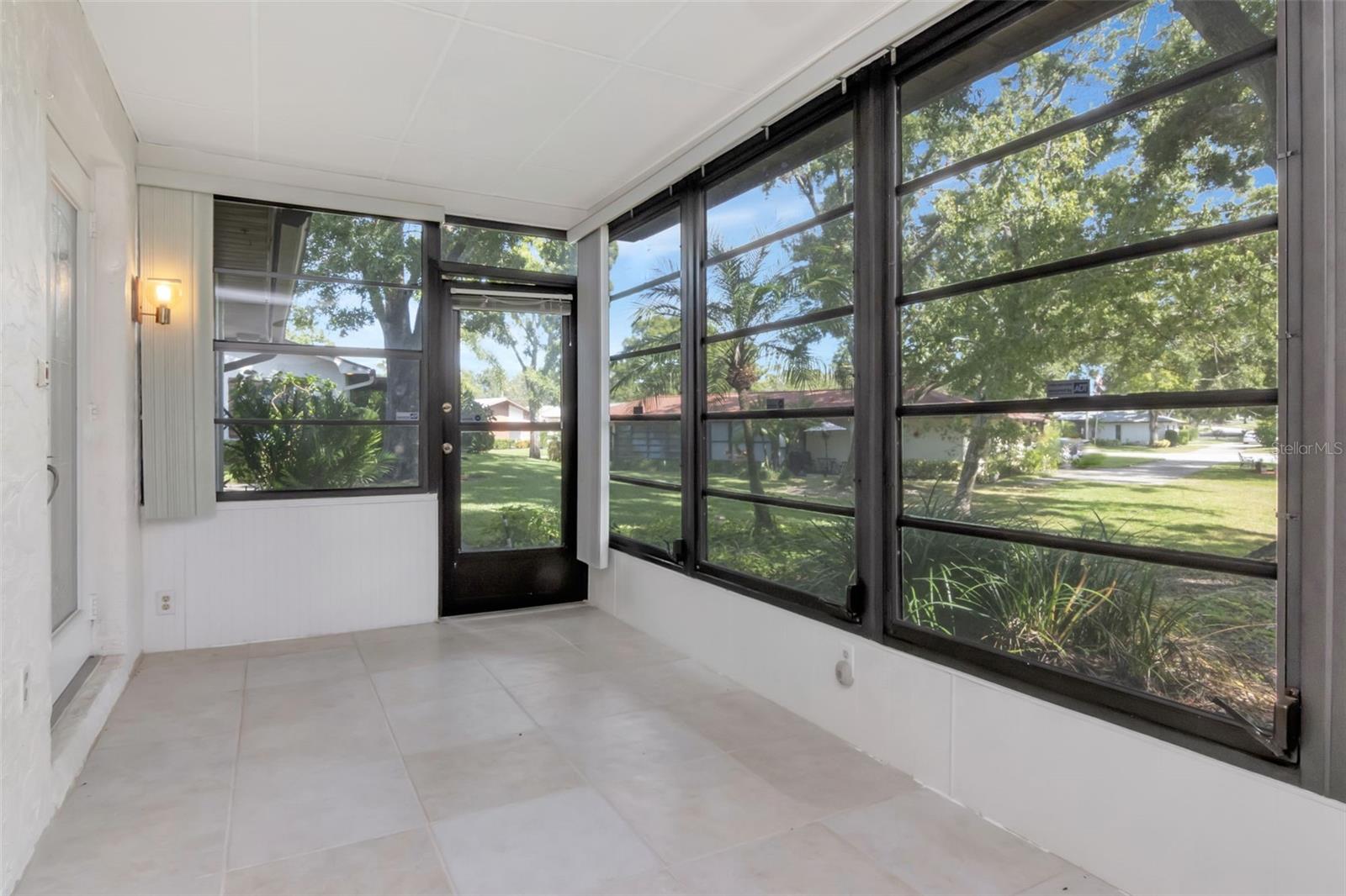 Newer tile flooring and the windows with vertical blinds are easy to operate~
