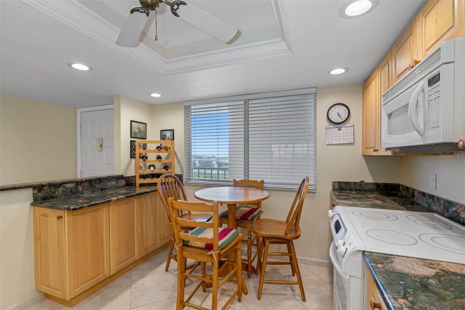 ... Kitchen Window Provides Plenty of Natural Light and some Water Views. Front Row Seats to Tennis & Pickle Ball Courts from Front Walkway.