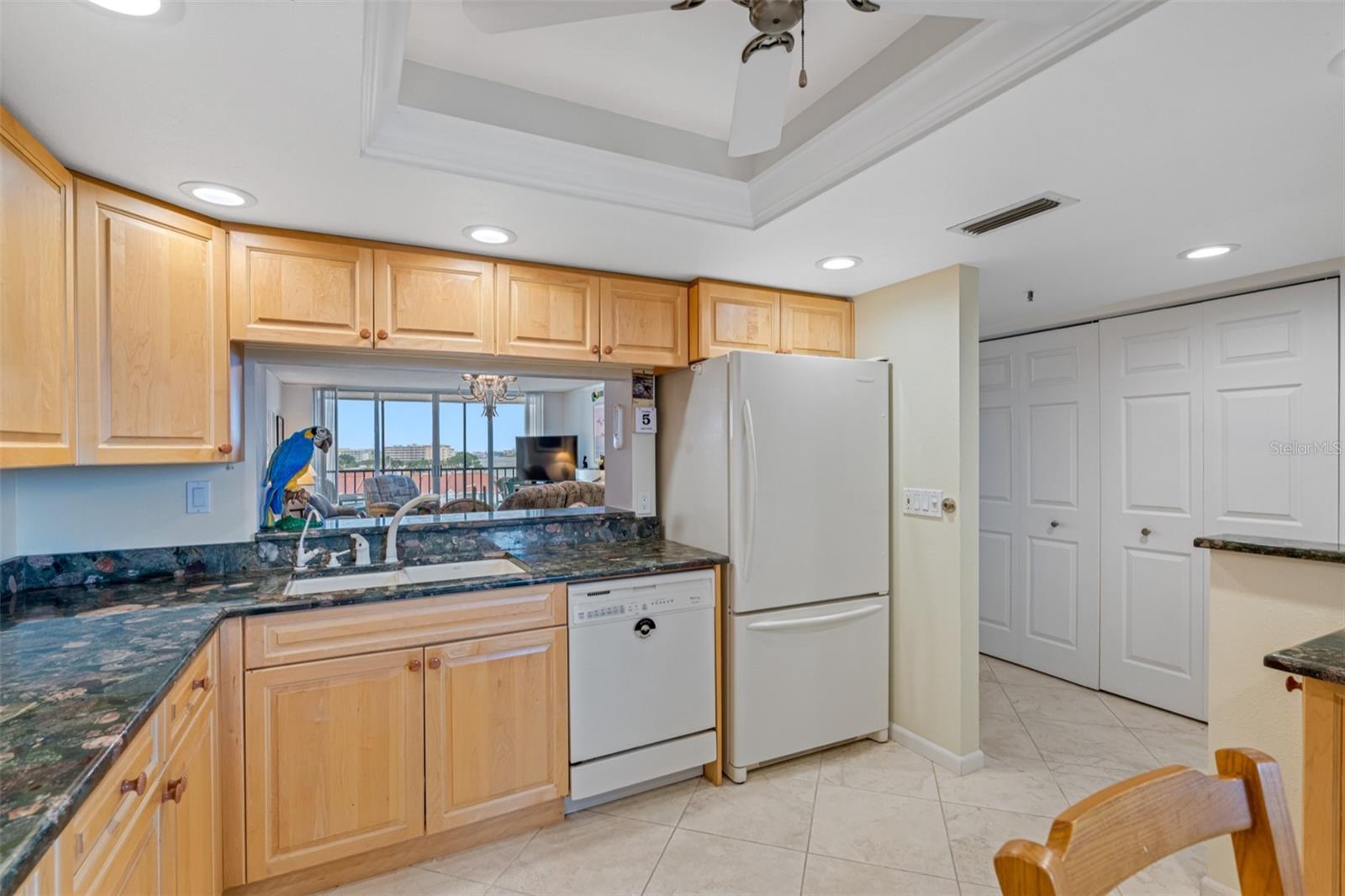 .. 12 x 12 Kitchen Looking out Towards Dining Room and Balcony.. Washer & Dryer on Right Thru 3 Panel Doors.
