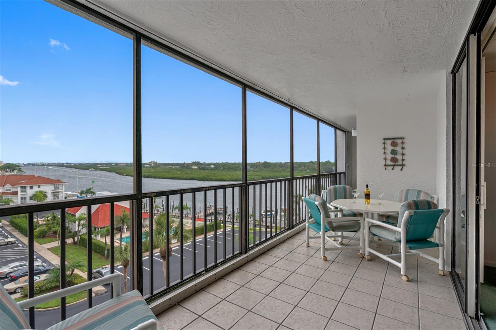 .. 30 Foot Waterfront Balcony - New Impact Sliders  - New Storm Shutters for Easy Shutdown When Departing.