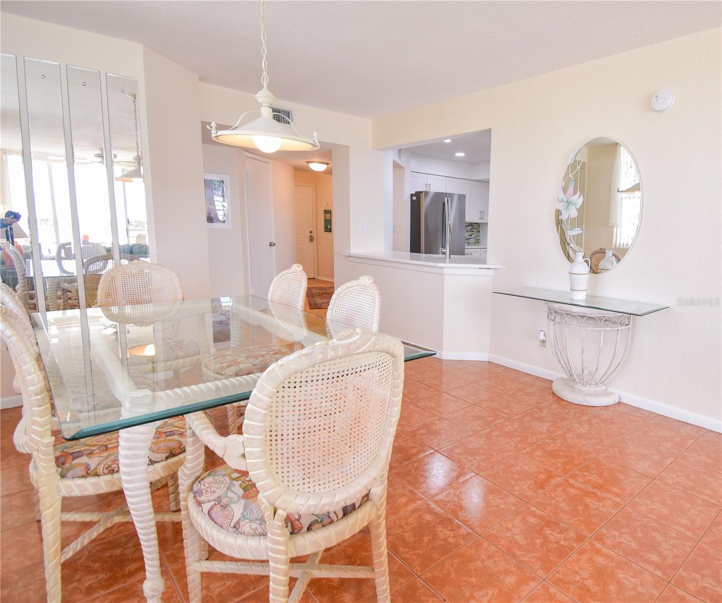 Primary Bedroom showing window overlooking pool and Pass-A-Grille channel