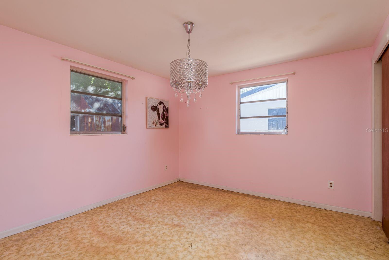 Bedroom w/ chandelier
