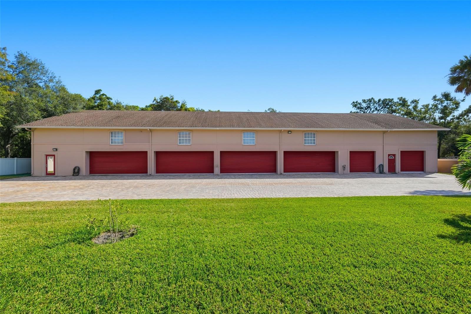 Apartment is the far left door. Far right door is the music studio.