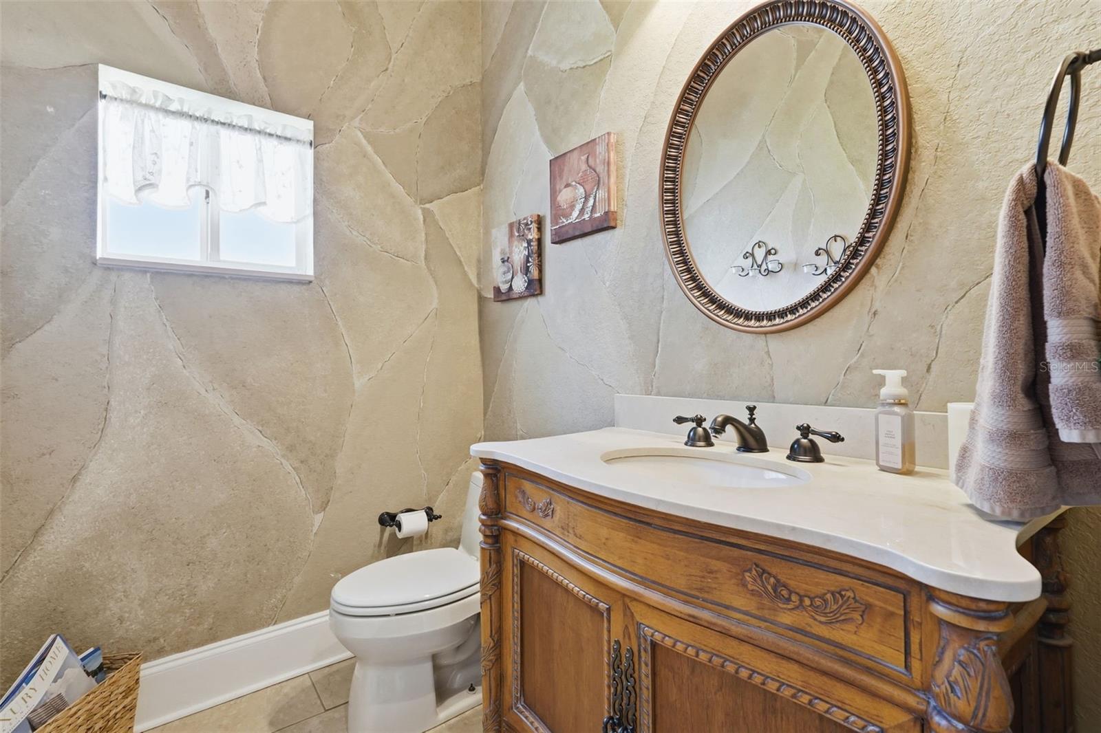 Half bath off of the foyer.