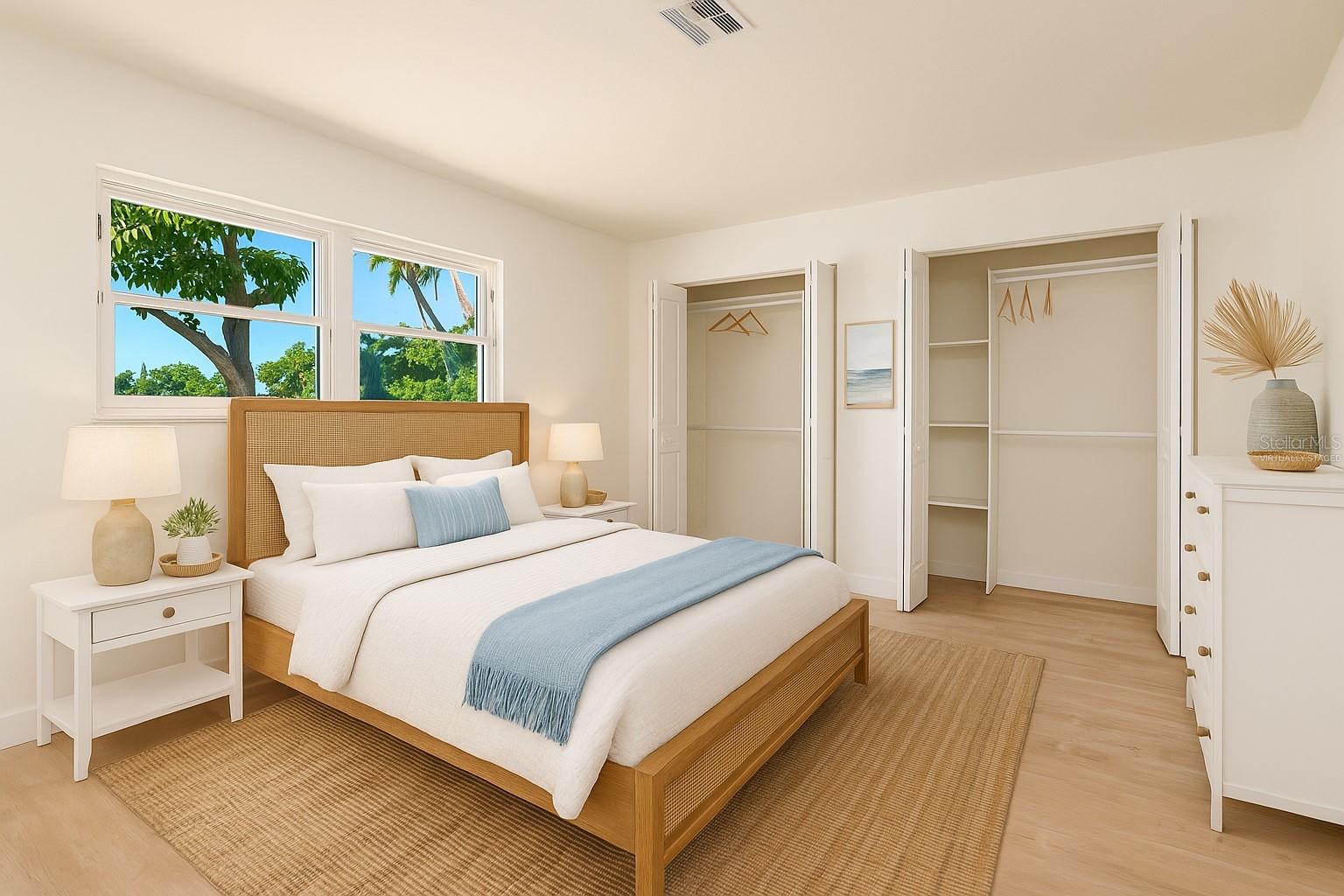 Comfortable waterfront guest suite offers privacy for visitors in this perfect split plan Florida home- virtually staged