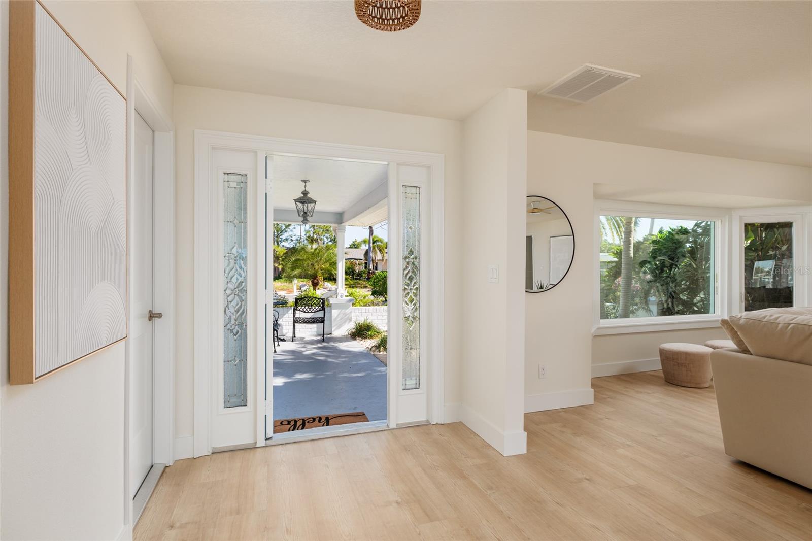 Grand entryway features designer lighting fixtures