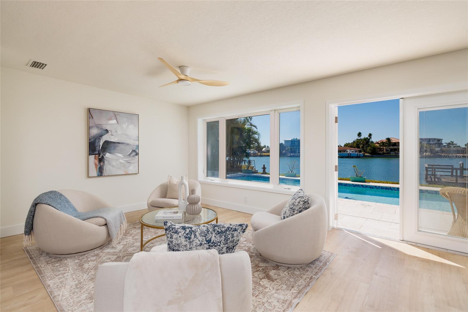 Poolside Sitting area with waterfront view