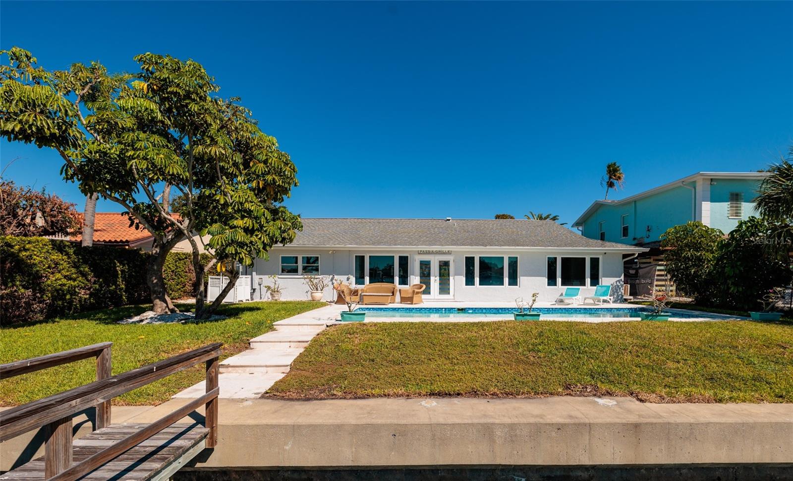 Stunning coastal Florida waterfront oasis with sparkling pool and private dock