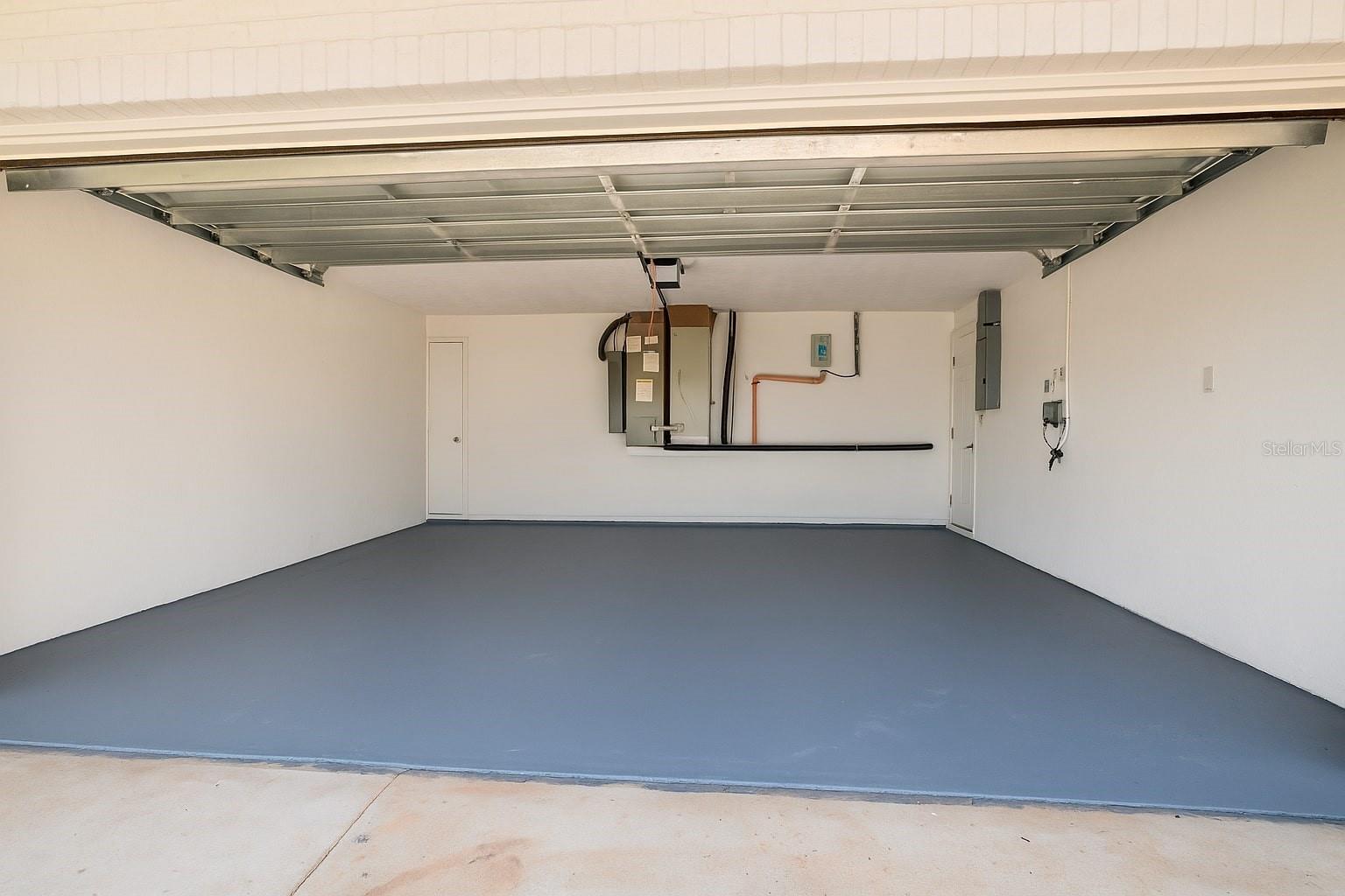Oversized two-car garage provides plenty of space for vehicles and storage