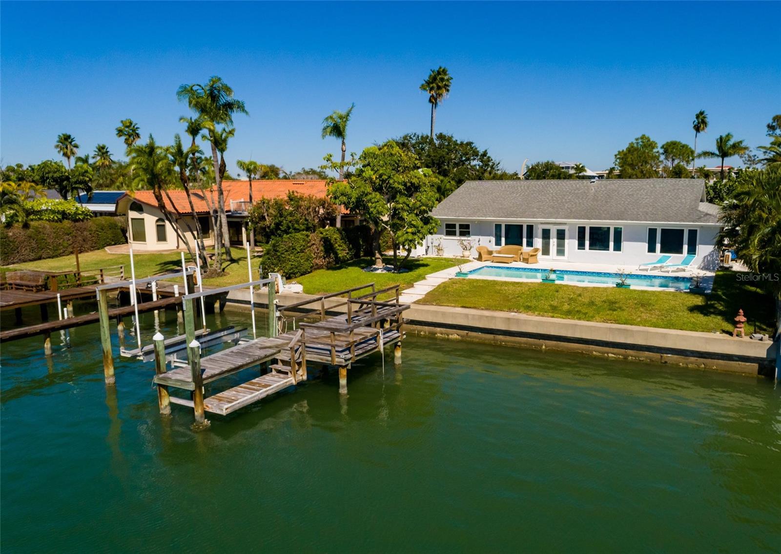 Coastal living at it's finest. Boat lift & the lower landing provides easy access for paddle board or Kayaks to launch